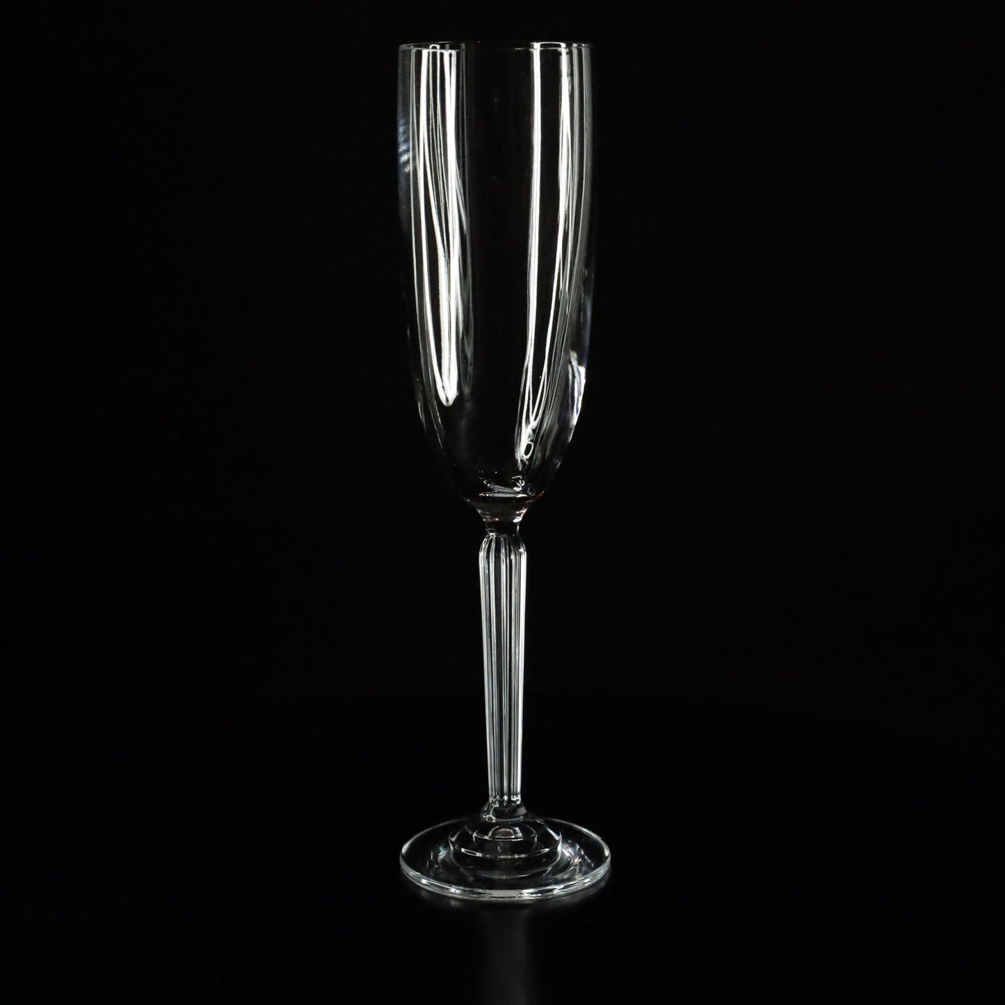 Elegant Aurora crystal champagne flute with a sleek, minimalist design, displayed against a black background.