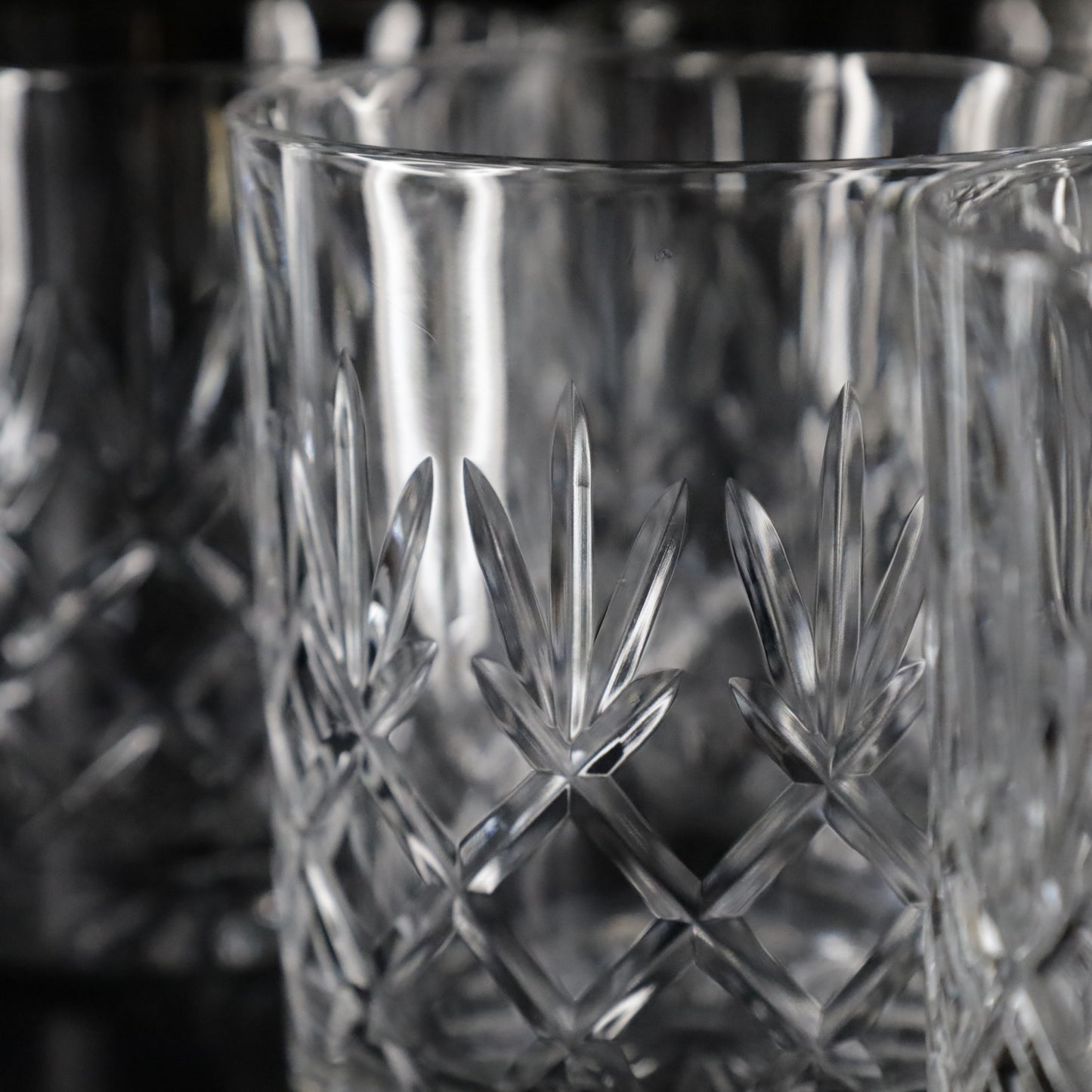 Classic Crown diamond-cut crystal tumblers, available in a versatile set of four for everyday or special use.