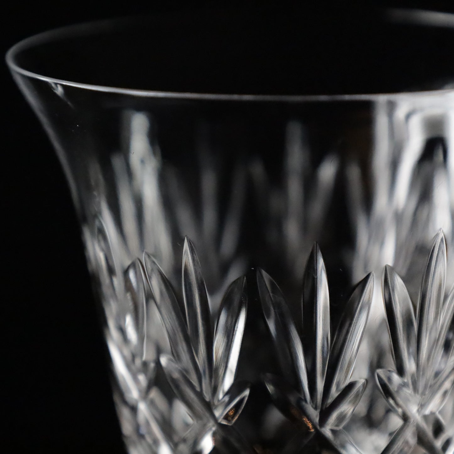 Luxurious Crown wine glasses with detailed crystal cuts and a timeless design, perfect for adding sophistication to any dining experience.