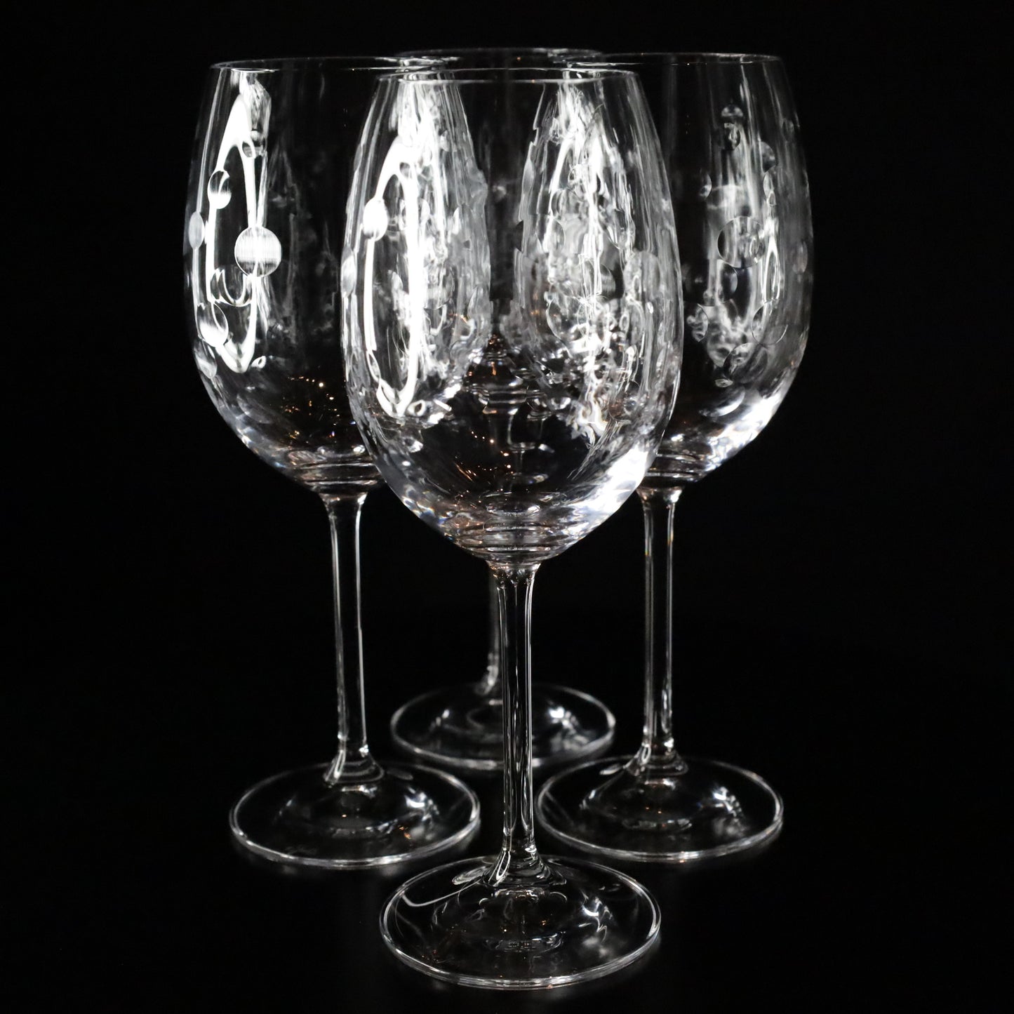 Nebula red wine glass with a minimalist yet striking design featuring delicate bubble engravings, radiating sophistication.