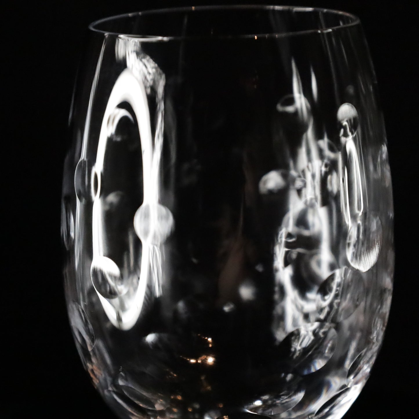 A Nebula red wine glass crafted with a contemporary etched bubble pattern, ideal for serving fine red wines.