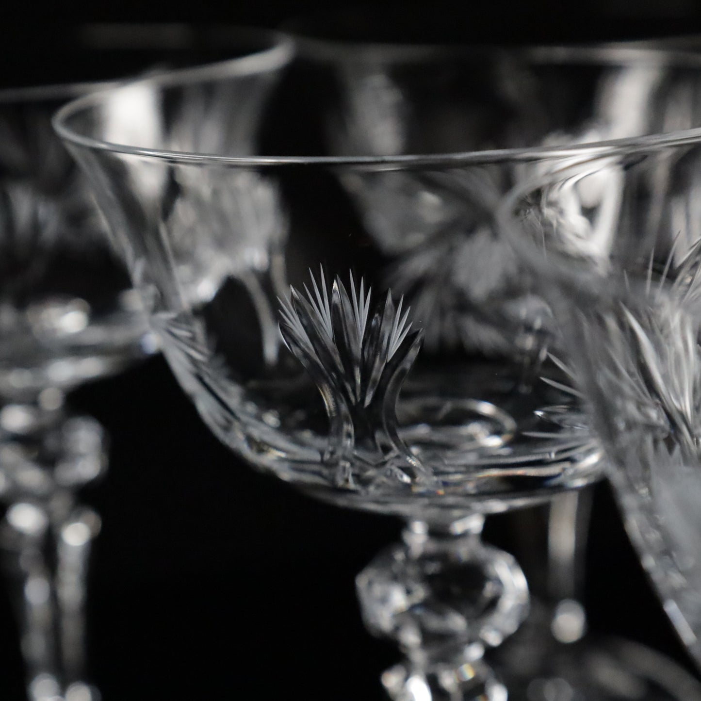 Close-up of Antoinette champagne glasses with intricate etching, showcasing their timeless beauty and refined craftsmanship.