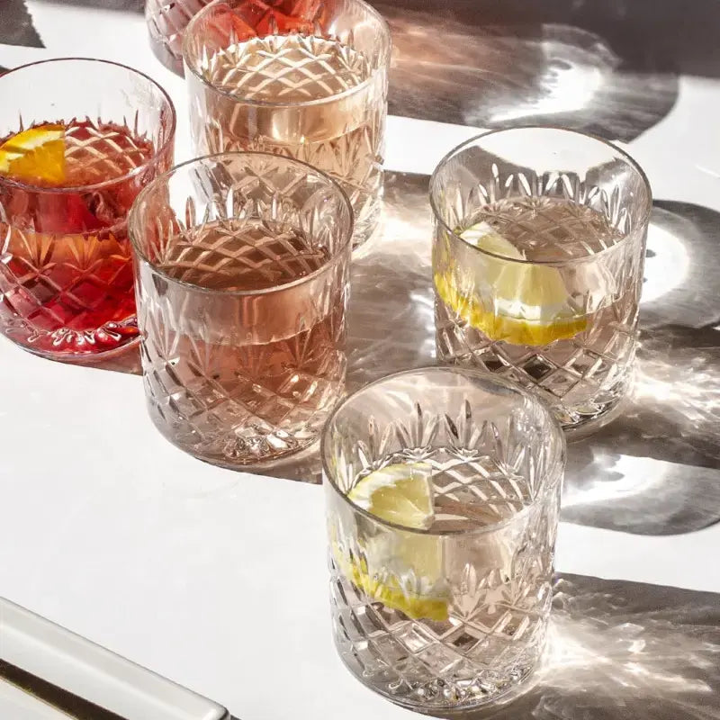 Elegant Crown Whiskey Glass featuring a classic etched pattern, crafted from high-quality crystal for timeless sophistication and durability.