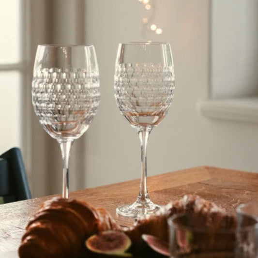 A Lily Red Wine Glass with a textured crystal bowl and slender stem, designed to enhance the aroma and flavor of red wines, perfect for elegant dining.