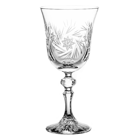 A set of crystal white wine glasses with a gracefully tapered bowl, delicate curves, and a slender stem.